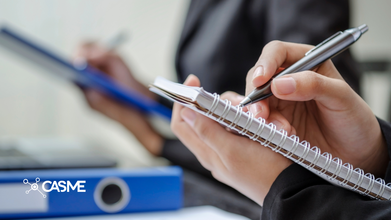 Image of person taking notes