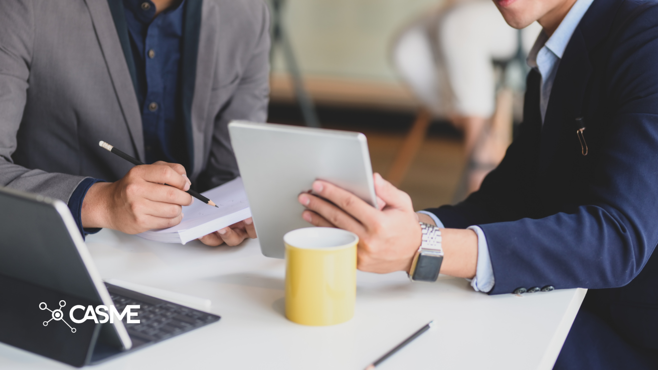 Image of two professionals reviewing documents