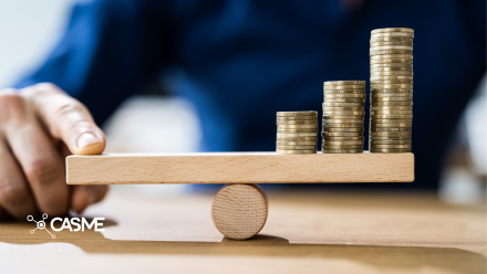 Man balancing coins on a wooden plank 