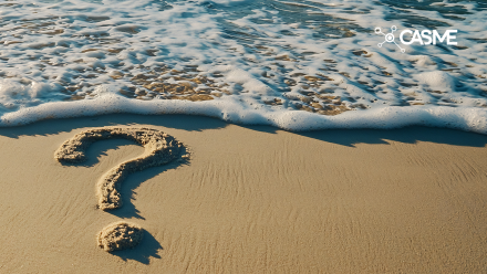 Question mark on a beach