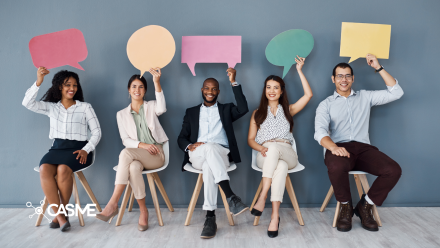 Group of professionals holding speech bubbles above their heads